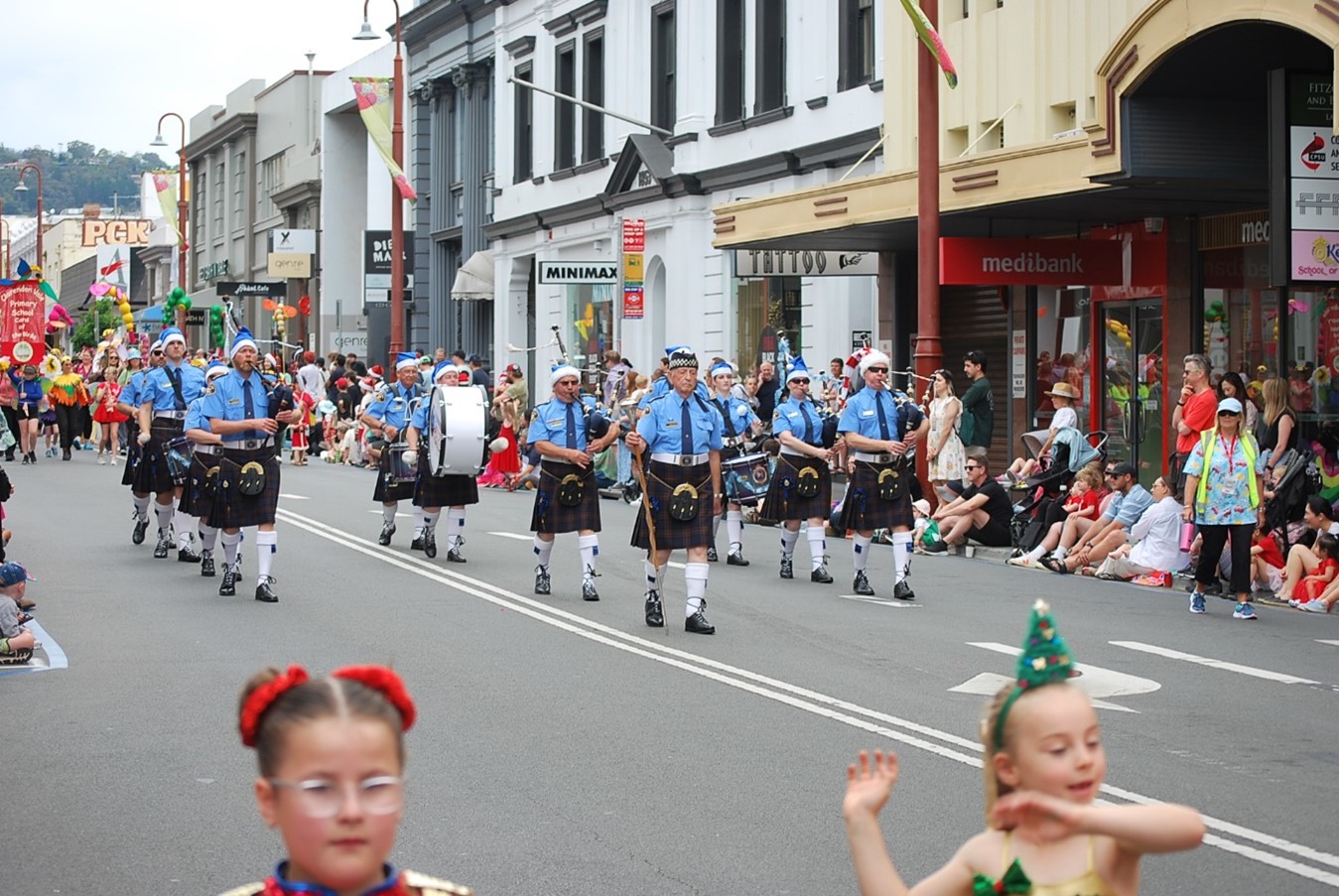 Pipe band parading in the 2024 Hobart Christmas Pageant