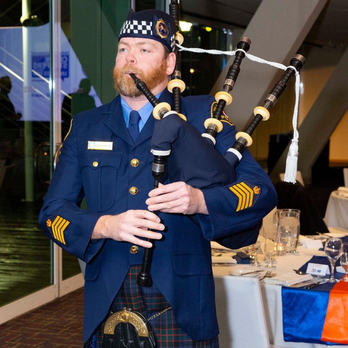 Pipe Mayjor, Fraser Bolton, at the Crime Stoppers 30th Anniversary celebrations in August 2024 playing the bagpipes.